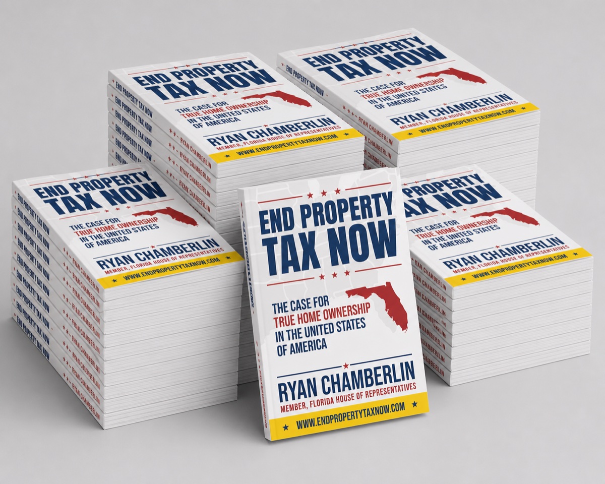 Stacks of End Property Tax Now books for a Bronze sponsorship order